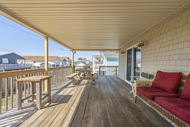 wooden deck with a residential view