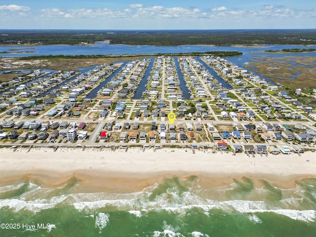 drone / aerial view with a view of the beach and a water view