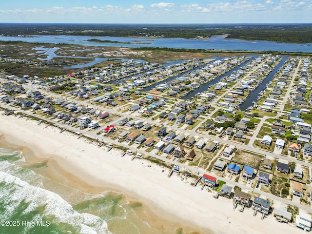 aerial view featuring a view of the beach and a water view