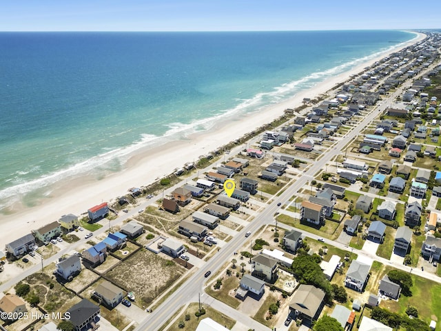 drone / aerial view with a view of the beach and a water view