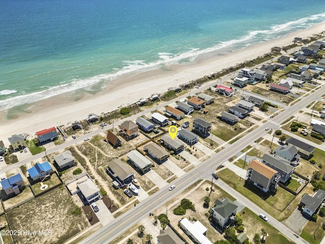aerial view with a water view, a beach view, and a residential view