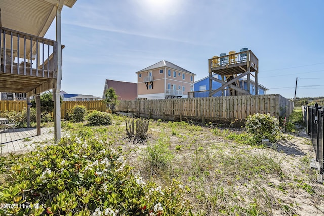 view of yard featuring a fenced backyard and a deck