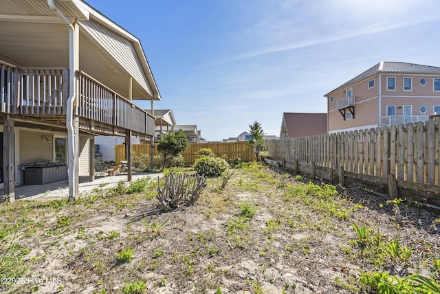 view of yard with a fenced backyard, a patio, and a deck