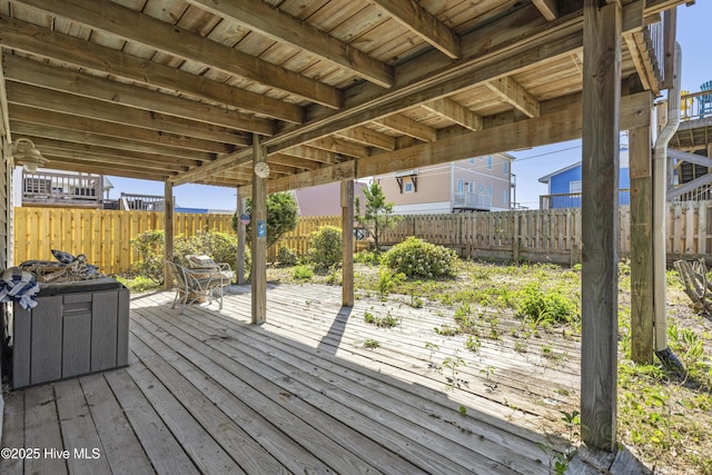 wooden deck featuring a fenced backyard