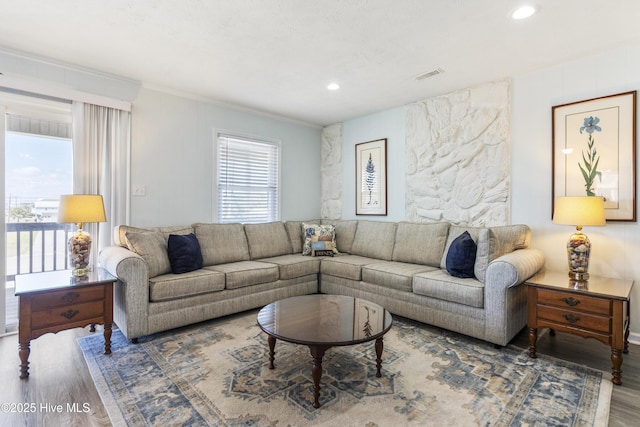 living room featuring visible vents, recessed lighting, crown molding, and wood finished floors
