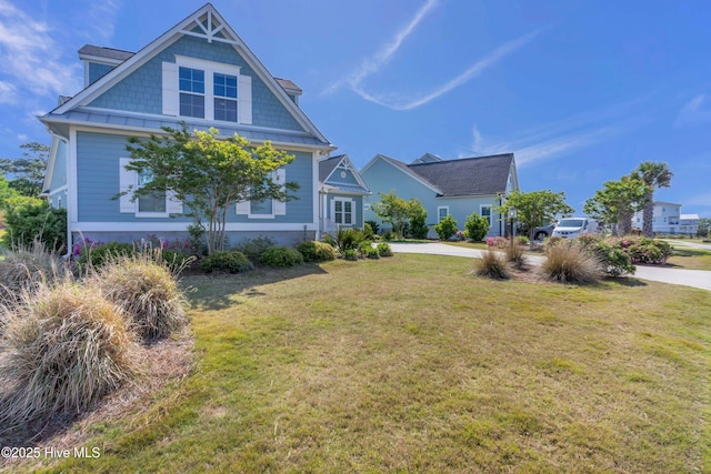 view of home's exterior with concrete driveway and a yard