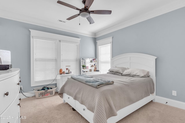 bedroom featuring visible vents, a ceiling fan, carpet, and crown molding