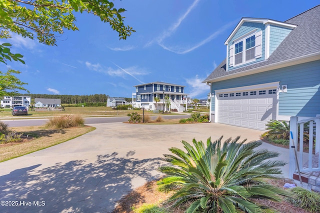 view of home's community featuring a garage and driveway