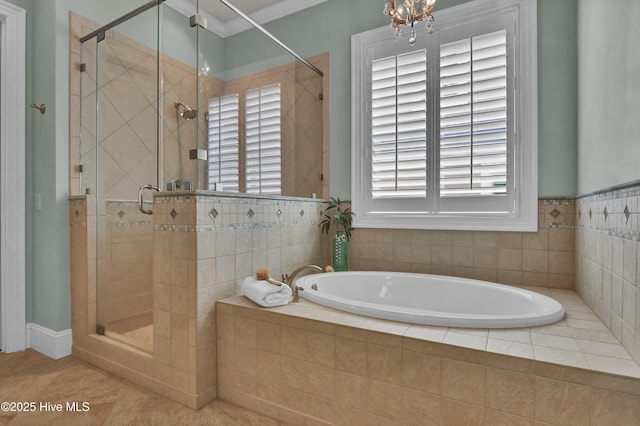 bathroom with a shower stall and a garden tub