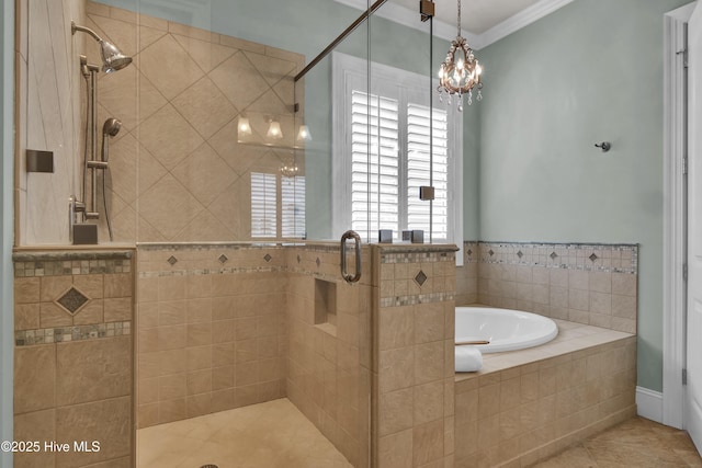 bathroom featuring a stall shower, ornamental molding, a bath, tile patterned floors, and a chandelier