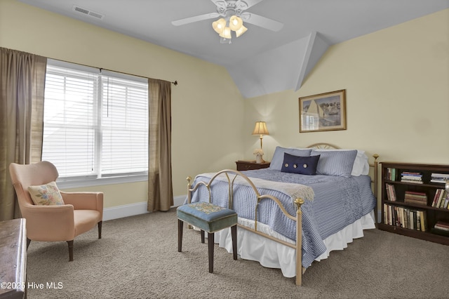 carpeted bedroom featuring multiple windows, baseboards, lofted ceiling, and ceiling fan