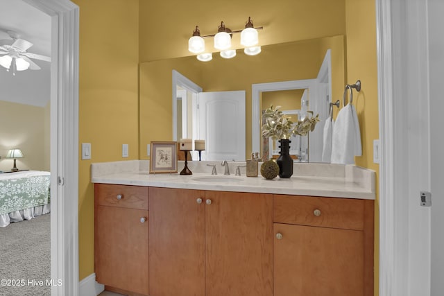 bathroom featuring a ceiling fan, vanity, and ensuite bathroom