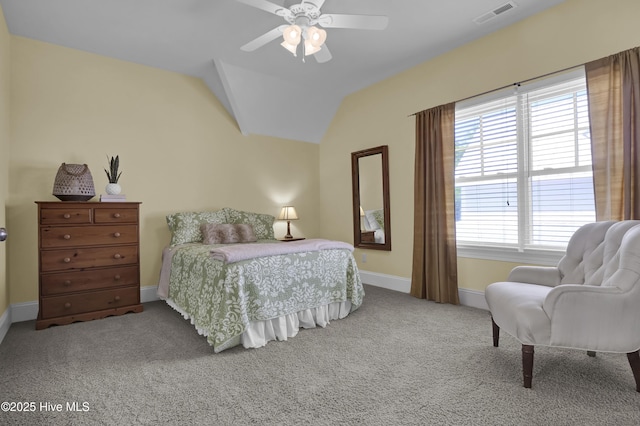 carpeted bedroom with baseboards, vaulted ceiling, and ceiling fan