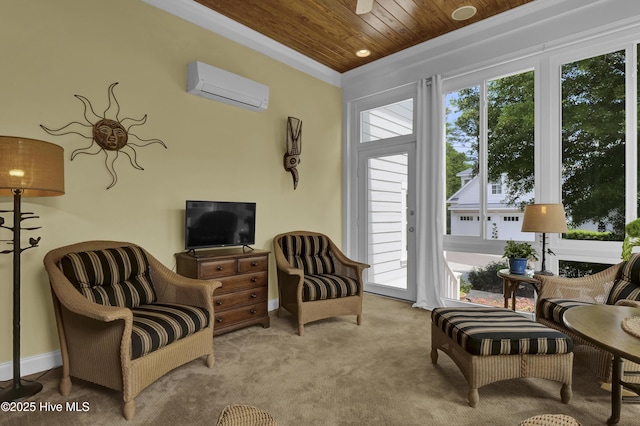 sitting room with an AC wall unit, wooden ceiling, carpet floors, and ornamental molding