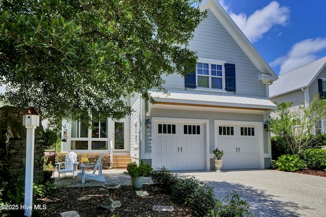 view of front facade with an attached garage and concrete driveway