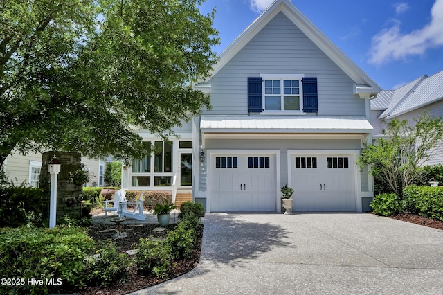 view of front of house featuring an attached garage and concrete driveway
