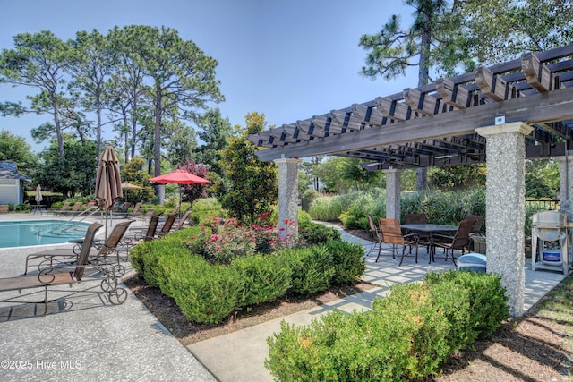 view of patio with a pergola, a community pool, and grilling area