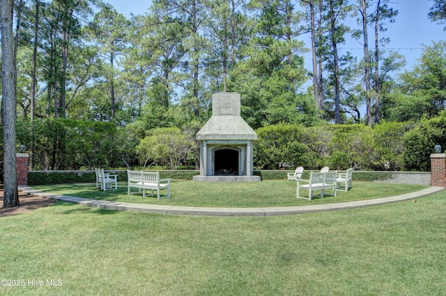 view of home's community featuring a yard and view of scattered trees