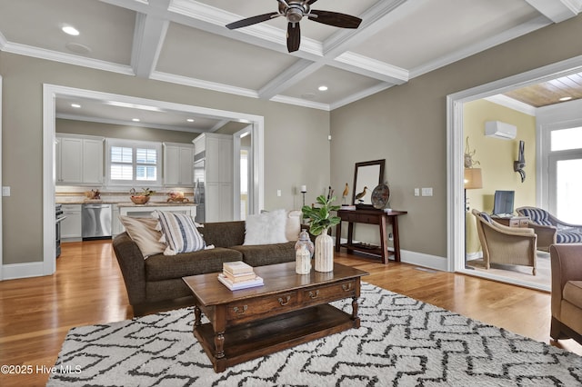 living area with crown molding, ceiling fan, light wood-style flooring, coffered ceiling, and a wall mounted air conditioner