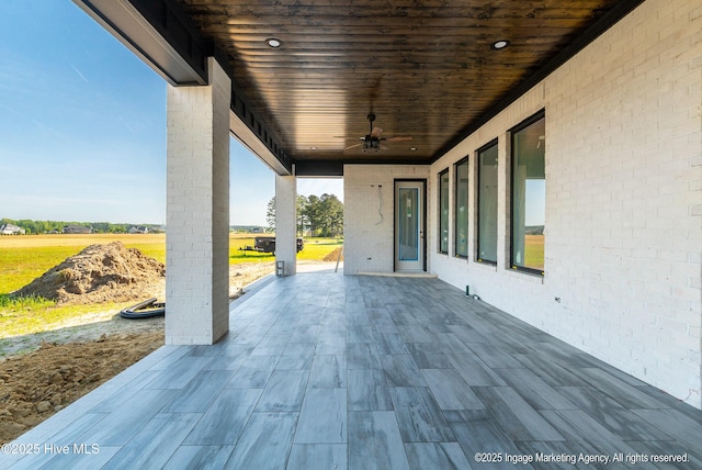view of patio / terrace featuring ceiling fan