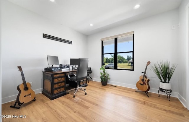 office area featuring baseboards, recessed lighting, and wood finished floors