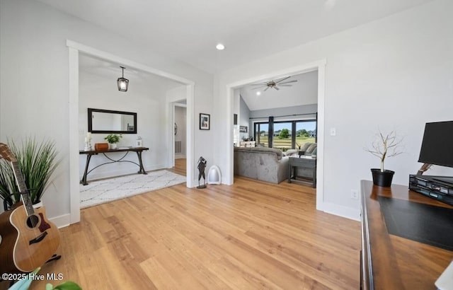 living room with a ceiling fan, baseboards, recessed lighting, and light wood finished floors