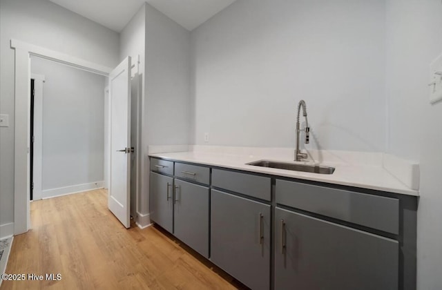 interior space with a sink and light wood-type flooring