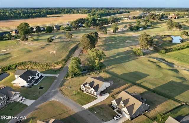 birds eye view of property with a residential view, view of golf course, and a water view