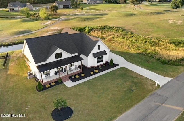 birds eye view of property with view of golf course