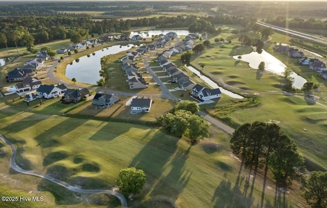 birds eye view of property featuring a water view and a residential view
