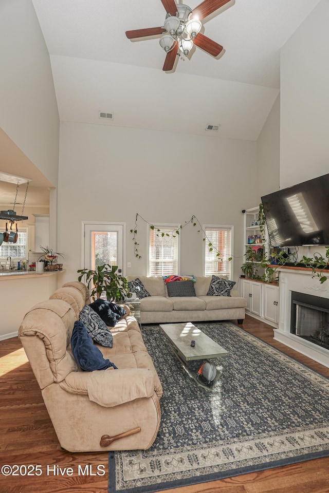 421 Celtic Ash St, Sneads Ferry, NC 28460 - living area featuring visible vents, plenty of natural light, wood finished floors, and high vaulted ceiling