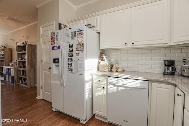 kitchen with ornamental molding, backsplash, white appliances, and white cabinetry