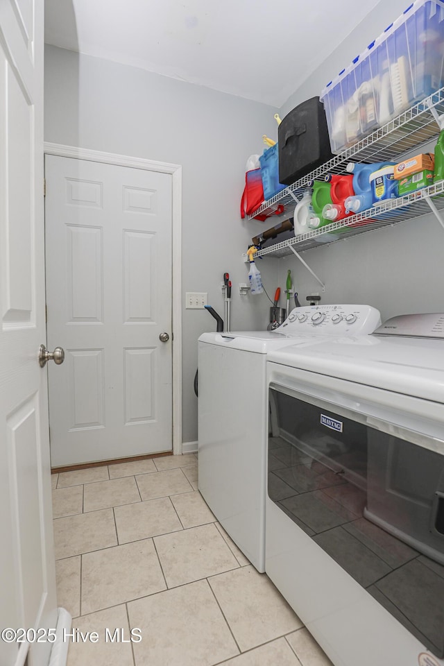 421 Celtic Ash St, Sneads Ferry, NC 28460 - washroom with laundry area, light tile patterned floors, and washer and dryer
