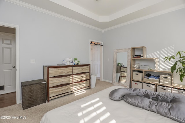carpeted bedroom with baseboards, ornamental molding, and a towering ceiling