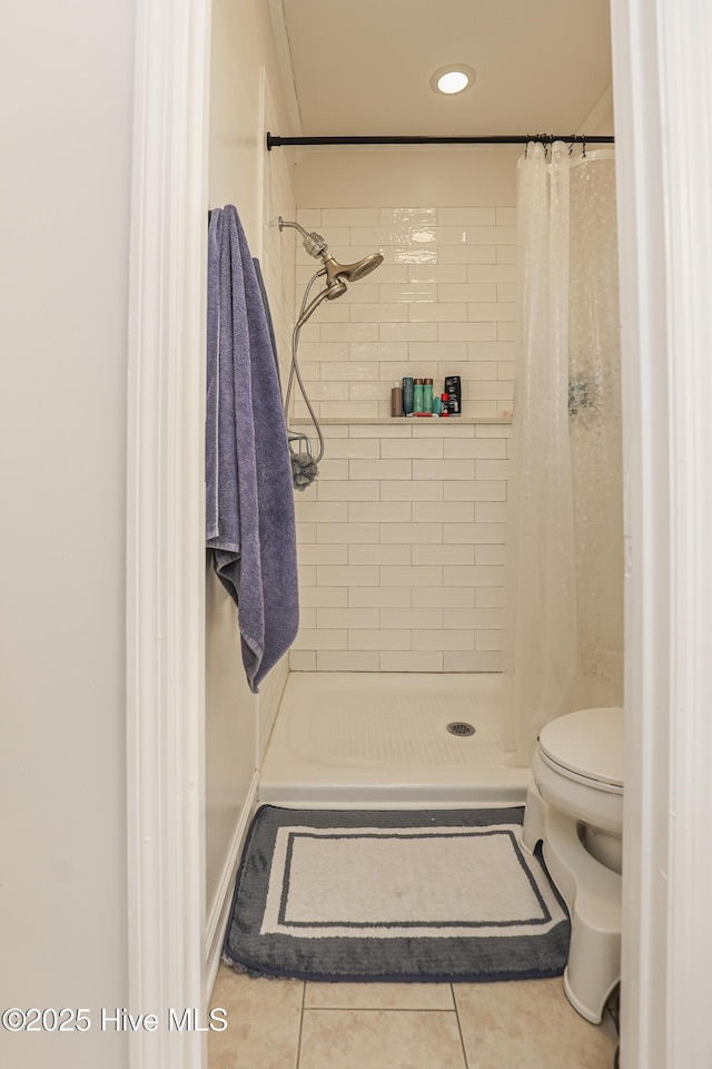 bathroom with tile patterned flooring, recessed lighting, a stall shower, and toilet