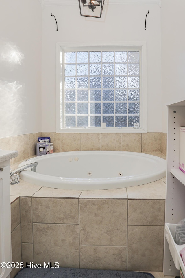 full bath featuring a whirlpool tub and a wealth of natural light