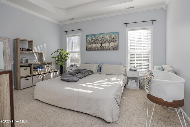 bedroom with multiple windows, ornamental molding, and visible vents