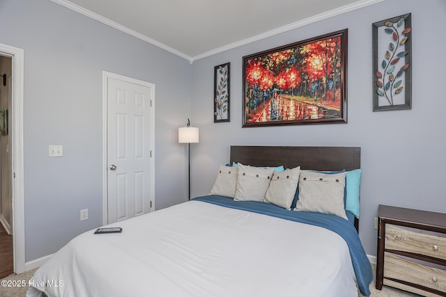 carpeted bedroom featuring crown molding and baseboards