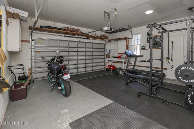 garage featuring a garage door opener and recessed lighting