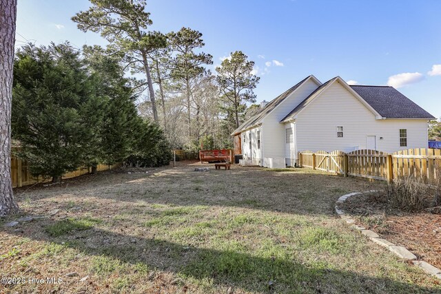 421 Celtic Ash St, Sneads Ferry, NC 28460 - view of yard with a wooden deck and a fenced backyard