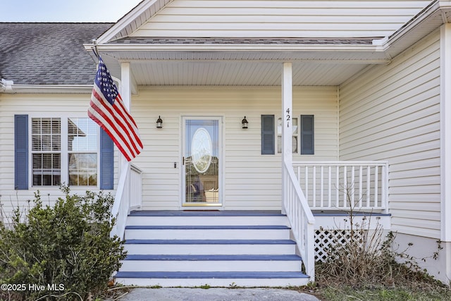 entrance to property featuring a porch