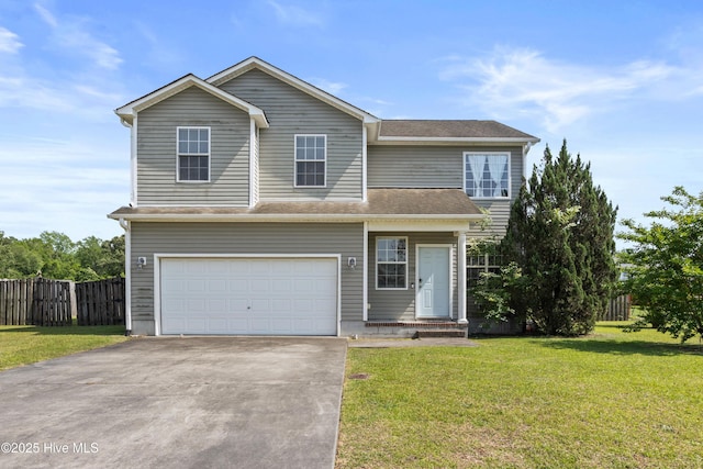 traditional-style home with a garage, a front lawn, fence, and driveway