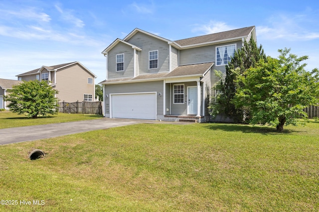 traditional-style house with concrete driveway, an attached garage, fence, and a front yard