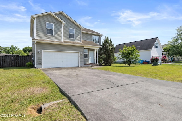 traditional home featuring fence, an attached garage, concrete driveway, and a front yard