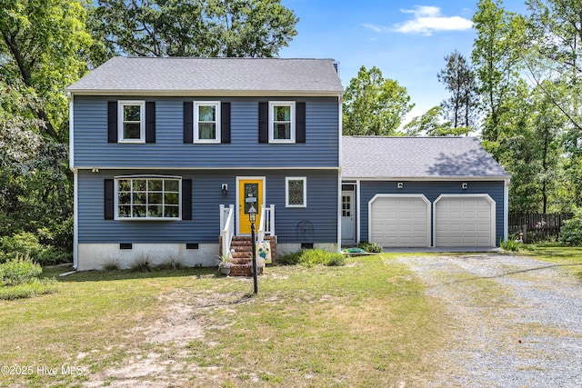 703 Baby Doe Cir, Hampstead, NC 28443 - colonial home with crawl space, an attached garage, driveway, and a front lawn