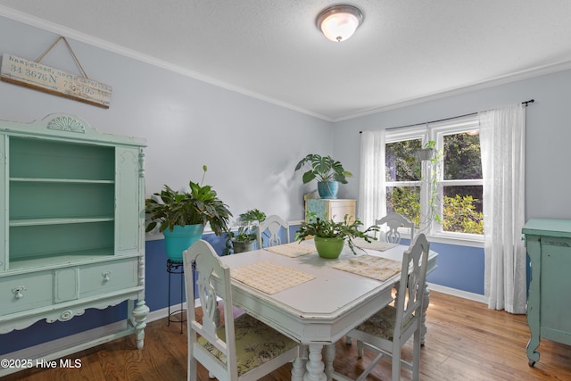 703 Baby Doe Cir, Hampstead, NC 28443 - dining space with crown molding, baseboards, and light wood finished floors