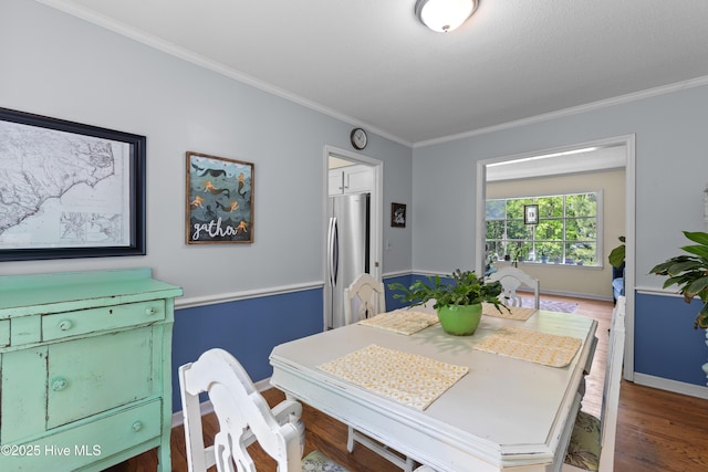 703 Baby Doe Cir, Hampstead, NC 28443 - dining area with baseboards, ornamental molding, and wood finished floors