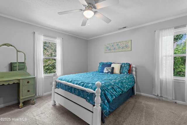 703 Baby Doe Cir, Hampstead, NC 28443 - bedroom with visible vents, ornamental molding, multiple windows, and light carpet