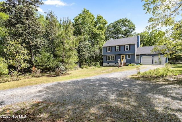 703 Baby Doe Cir, Hampstead, NC 28443 - colonial-style house with a garage and driveway