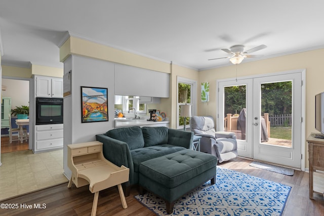 703 Baby Doe Cir, Hampstead, NC 28443 - living area featuring ceiling fan, ornamental molding, french doors, and light wood-style floors